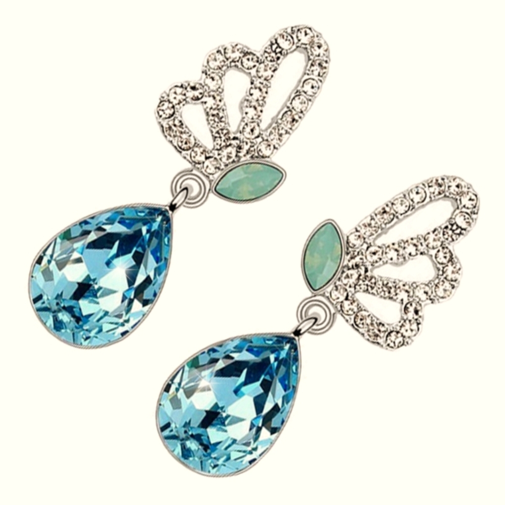 Silver earrings with light blue crystals. butterfly shape Size 3cm long￼